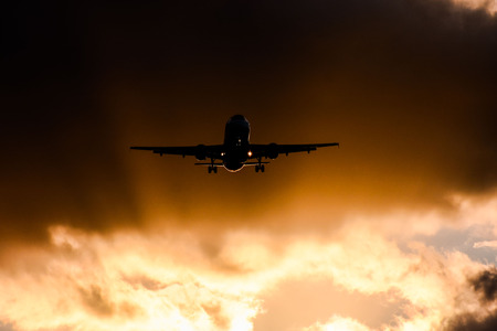 Photo picture Silhouette airplane flying on the skyの写真素材