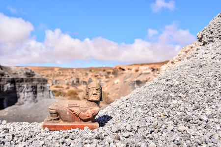 Conceptual Photo Picture of a Mayan Statue in the dry desertの写真素材