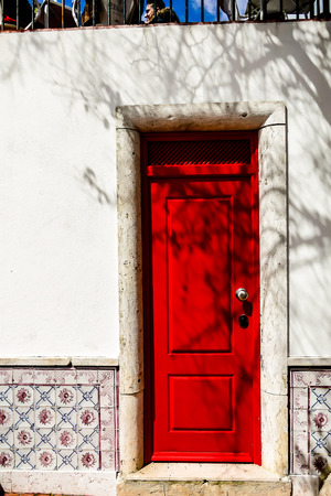 door in red wall, beautiful photo digital pictureの写真素材