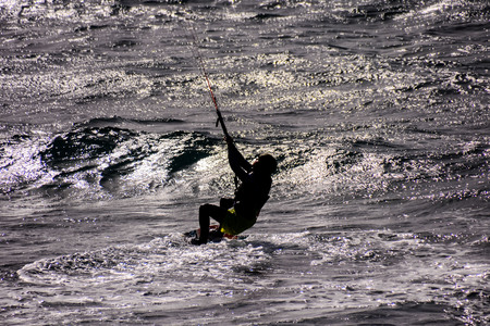 Single surfer at sunset on a calm oceanの写真素材