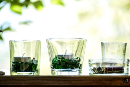 glass of water on table in garden, beautiful photo digital pictureの写真素材