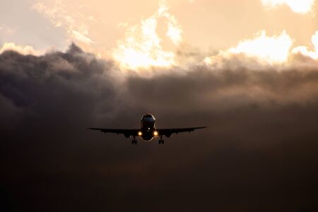 Photo picture Silhouette airplane flying on the skyの写真素材
