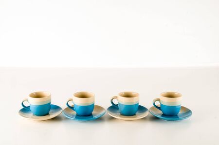 Small modern espresso cups on a white backgroundの写真素材