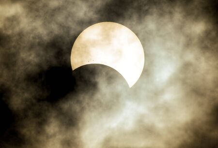 Partial Solar Eclipse on a Cloudy Day 03.11.2013の写真素材