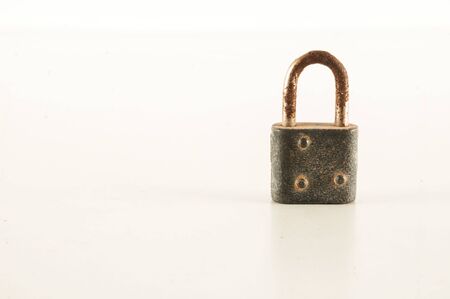 vintage metal steel lock padlock on white backgroundの写真素材