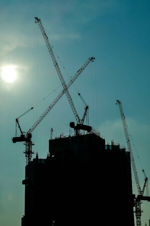 silhouette of crane on construction site, beautiful photo digital pictureの写真素材
