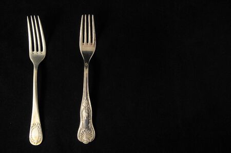 Ancient Vintage Silver Flatware on a Black Backgroundの写真素材