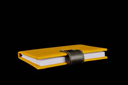 Close-up of note book Object on a Black Backgroundの写真素材
