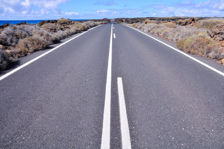 Long Empty Desert Asphalt Road in Canary Islands Spain