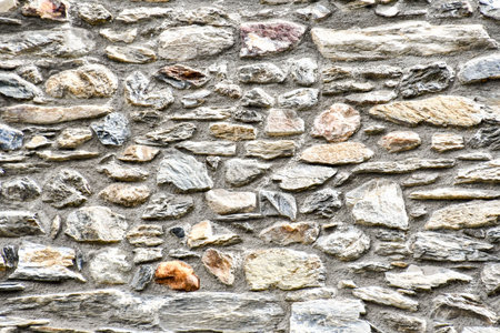 old stone wall of stones, photo as a background, digital image