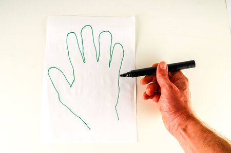 Close-up of sheet with drawing Object on a White Backgroundの写真素材