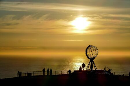 silhouette of man standing in front of sunset, beautiful photo digital pictureの写真素材