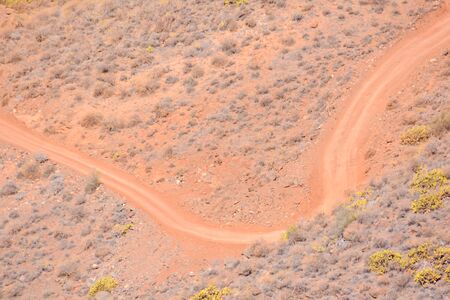 Photo Picture of a Dirt road leading off into the desertの写真素材