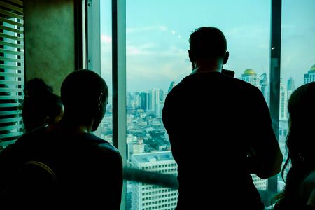 silhouette of man in front of window, beautiful photo digital pictureの写真素材
