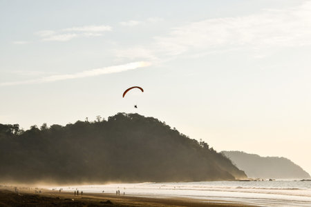 paragliding on the beach, photo as a background, digital image