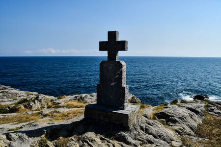 lighthouse on rock in sea, photo as a background, digital imageの写真素材