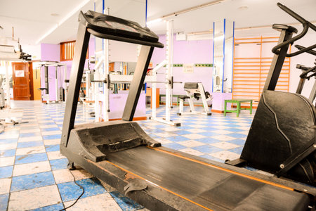 Equipment And Machines At The Empty Modern Gym Room Fitness Center