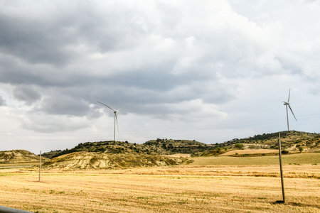 wind turbines in field of wheat, photo as a background, digital image
