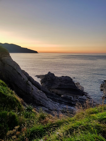 sunset on coast of sea, photo as a background, digital image