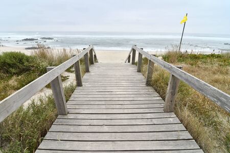 boardwalk to the beach, photo as a background , in north portugal, europe , In Afife, Viana do Castelo, north portugal.の写真素材