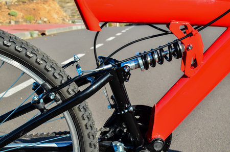 Close up of Modern Red Full Suspension Mountain Bike MTB Bicycle