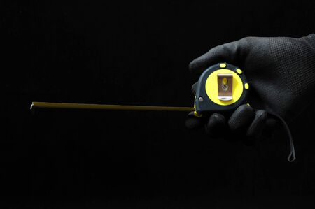 Meter and a Hand on a Black Backgroundの写真素材