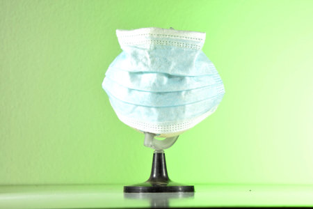 Save The World From The Corona Virus. World need protect the earth globe with a face mask. covid 19...