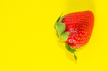 Fresh Ripe Strawberry Fruit on a Colored Backgroundの写真素材