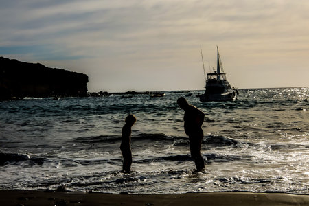 Photo Picture of a Boat Silhouette at Sunsetの写真素材