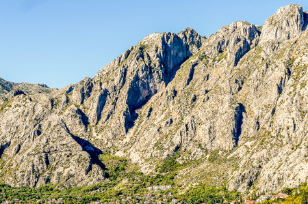 The mountains are covered in rocks and the sky is clear. The mountains are very tall and the rocks are very largeの写真素材