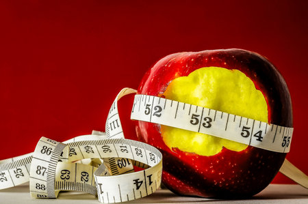 Diet Apple and Meter on a Colored Backgroundの写真素材