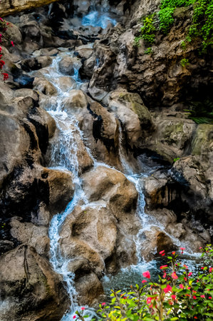 Small River Waterfall Between some Brown Rocksの写真素材
