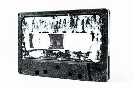 Ancient Vintage Used Musicassette over a White Backgroundの写真素材