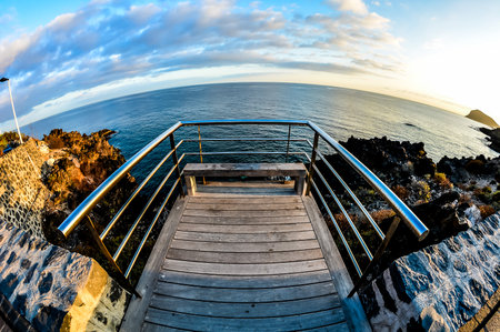 Sunrise on a Pier over Atlantic Oceanの写真素材