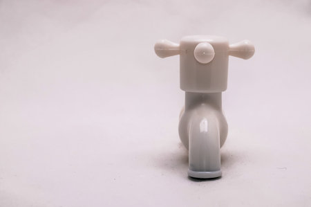 One White PVC Plastic Bathroom Water Faucetの写真素材