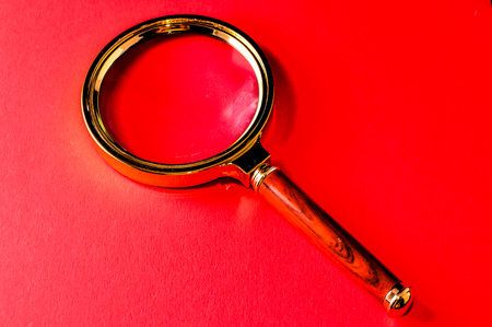 Vintage Magnify Glass Loupe on a Colored Backgroundの写真素材