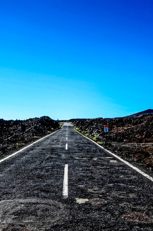 Long Empty Desert Asphalt Road in Canary Islands Spainの写真素材