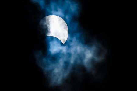 Partial Solar Eclipse on a Cloudy Day 03.11.2013の写真素材