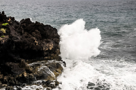 Strong Waves Crashing on the Volcanic Coast in Tenerife Canary Islandsの写真素材