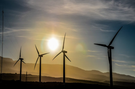 Renewable Energy Concept Windmill Farm at Sunsetの写真素材