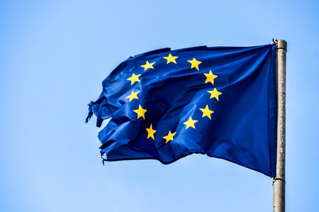 Old European Flag on a Blue Skyの写真素材