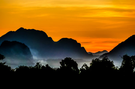 sunset in mountains, beautiful photoの写真素材
