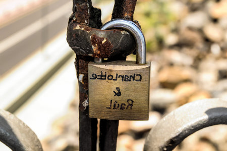 A rusted lock with the words written on itの写真素材