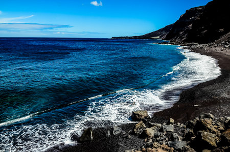 The ocean is calm and the sky is blueの写真素材