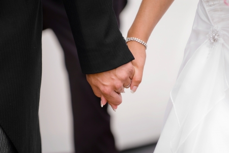 Just married couple holding hands on there journing together.の写真素材