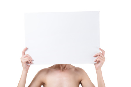 naked woman holding empty white blank board isolated on white backgroundの写真素材