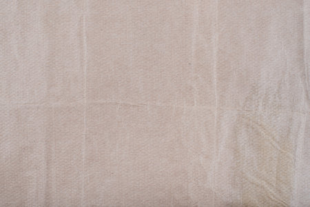 Old Texture of rough crumpled craft brown recycled vintage aged dirty grainy paper with natural...