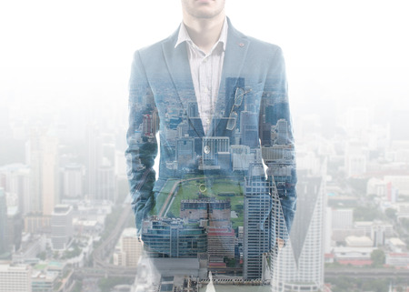 Double exposure businessman and city.の写真素材