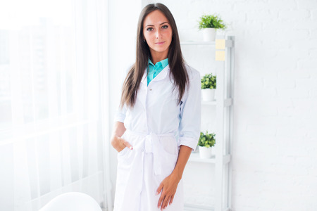 Portrait of woman doctor standing in the hospitalの写真素材