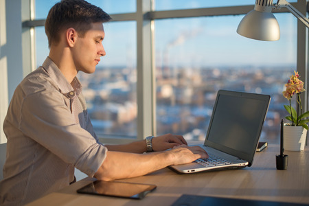 Freelance work. man working on laptop computerの写真素材